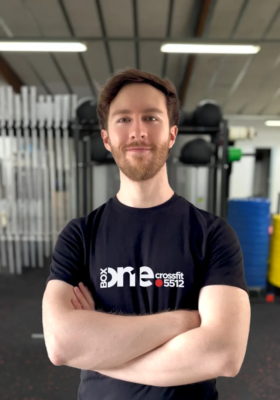 Rory, manager hos Box One, fotograferet foran den samme grå baggrund som resten af holdet.